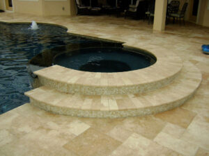 Pool with circular spa and mosaic tile steps