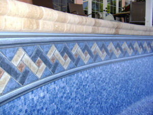 Close-up of pool tiles and border