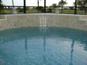 Curved pool with sheet waterfall