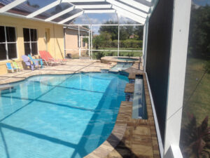 Solar-paneled pool with patio chairs